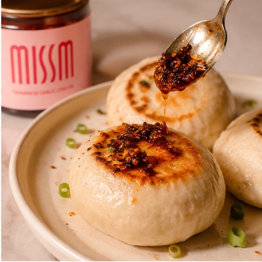 Pan fried bao drizzled with chili oil